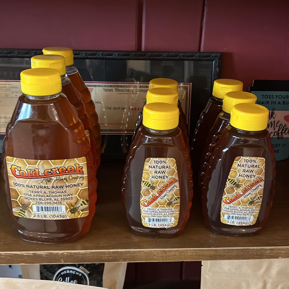 Bottles of Cold Creek 100% natural raw local honey